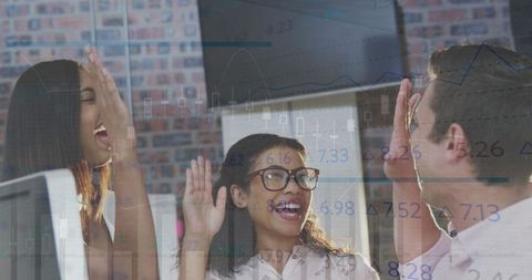 Diverse Team Celebrating Success with Double Exposure of Financial Graphs
