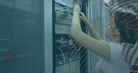 Technician Configuring Server Wires for Network Stability - Download Free Stock Images Pikwizard.com