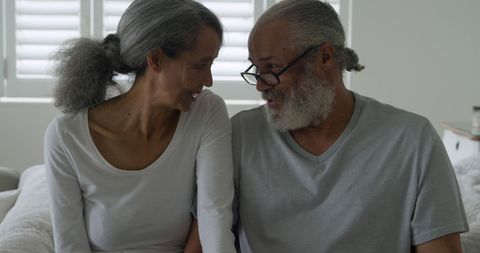 Senior Couple Shares Tender Moment at Home with Joyful Empathy