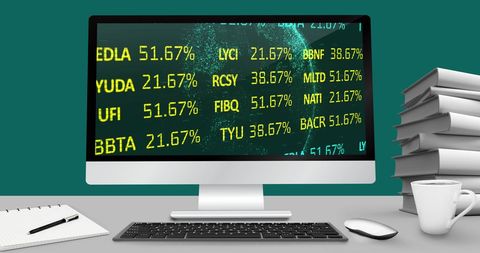 Financial stock data displayed on modern computer setup