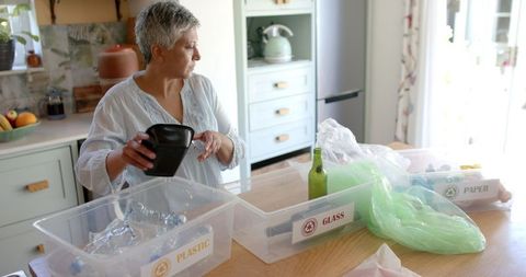 Senior Woman Practicing Home Waste Segregation and Recycling
