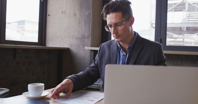 Young Professional Working on Office Task at Desk - Download Free Stock Images Pikwizard.com