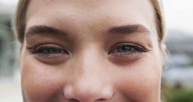 Close-up of Smiling Young Woman's Eyes and Forehead Outdoors - Download Free Stock Images Pikwizard.com