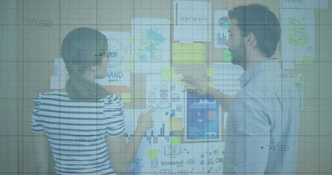 Collaborating team pointing at planning board with charts, sticky notes and analytics overlay