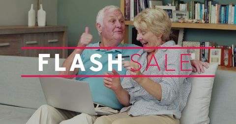 Elderly Couple Celebrating Success of Online Flash Sale at Home