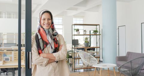 Confident Businesswoman Wearing Patterned Scarf in Modern Office