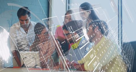 Diverse business team analyzing financial data with virtual display