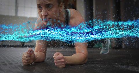 Mid Adult Woman Holding Forearm Plank Demonstrating Core Strength with Blue Energy Ribbon Effect