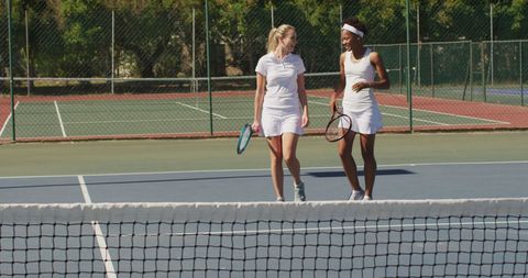 Happy Diverse Female Tennis Players Sharing a Lively Conversation - Download Free Stock Images Pikwizard.com