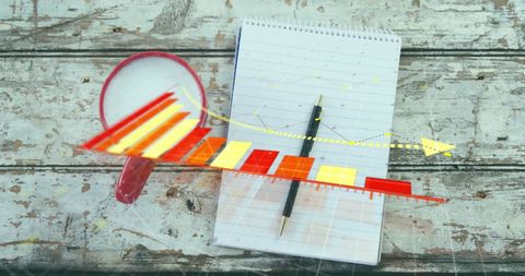 Decreasing Bar Graph and Notebook with Coffee Mug on Wood Table