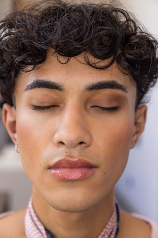 Young Man With Eyes Closed Focusing on Inner Calm