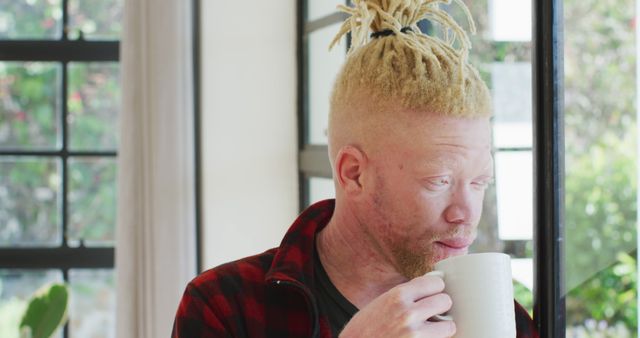 Albino Man with Dreadlocks Drinking Coffee by Sunny Window - Download Free Stock Images Pikwizard.com