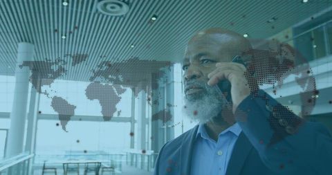 African American Businessman Using Smartphone with Global Map Interface