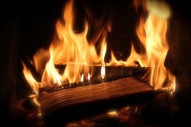Warm Glowing Fireplace with Burning Log - Download Free Stock Photos Pikwizard.com