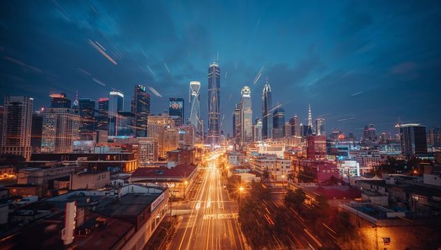 Futuristic urban cityscape with light trails at night