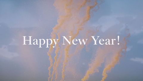 Happy New Year Greeting with Pastel Smoke Plumes and Sparkling Particles