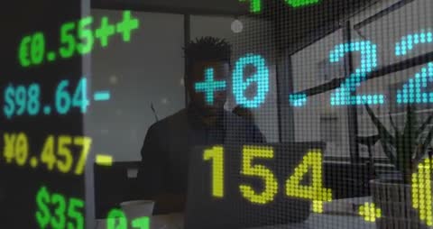 Stock Market Accountant Typing Behind Financial Data Display