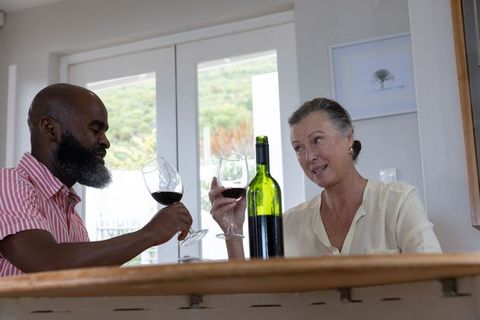 Senior Couple Enjoying a Wine Toast at Home