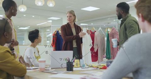 Diverse Team Analyzing Fashion Data in Modern Office Setting