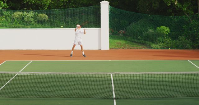 Player Jumping to Hit a Forehand Shot on Tennis Court - Download Free Stock Images Pikwizard.com