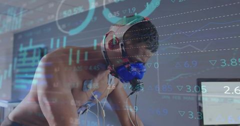 Athlete undergoing vo2 max testing on ergometer with respiratory mask and ecg sensors