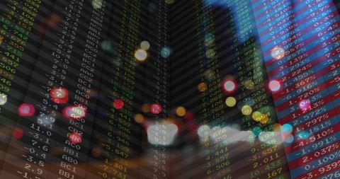 Colorful Financial Ticker Against Urban Bokeh Lights