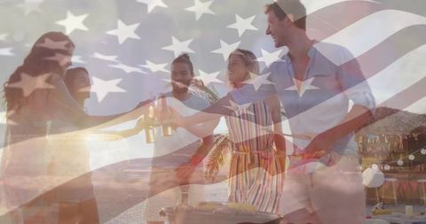 Patriotic beach barbecue group clinking bottles at sunset with american flag overlay