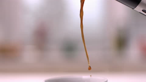 Slow Motion Coffee Pouring into Cup for Morning Routine