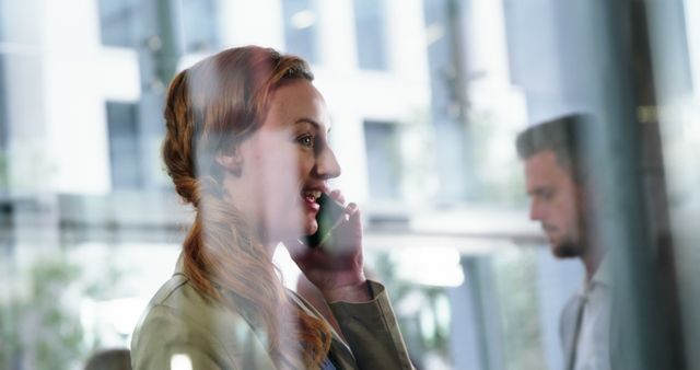 Businesswoman speaking on phone in modern office - Download Free Stock Images Pikwizard.com