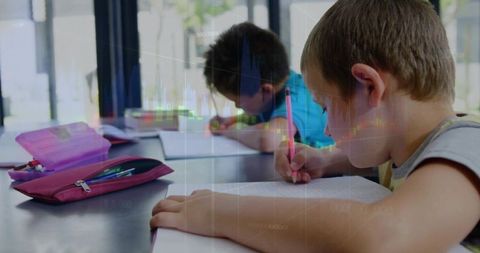 Elementary Students Writing with Pencil Cases Focusing on Study and Classroom Learning