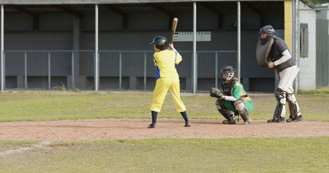 Youth Baseball Game Batter at Plate Ready to Swing