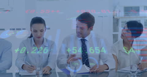 Business Team Analyzing Financial Data and Graphics