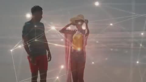 Couple Enjoying Beach Walk with Digital Network Overlay Concept