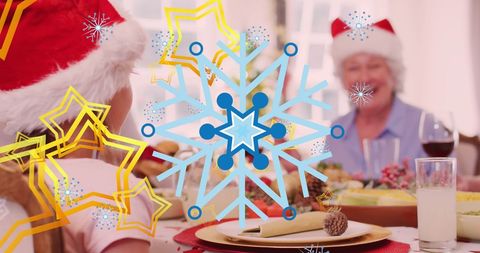 Festive Family Dinner Table with Santa Hats and Digital Snowflakes