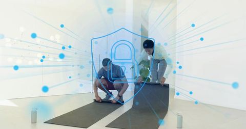 Unrolling yoga mats together in modern studio featuring digital security shield overlay