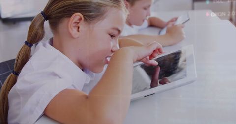 Children Learning with Digital Tablets in Classroom