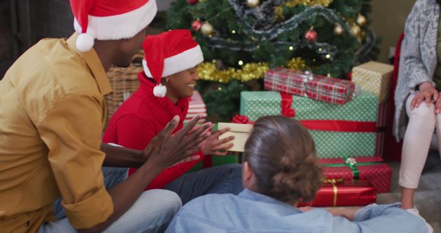 Family Opening Christmas Presents by Decorated Holiday Tree - Download Free Stock Images Pikwizard.com