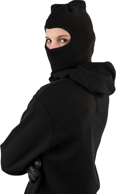 Female hacker standing in black hoodie and balaclava looking ominous - Download Free Stock Videos Pikwizard.com