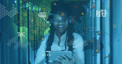 Smiling woman presenting tablet with interactive global data overlay, wearing headset