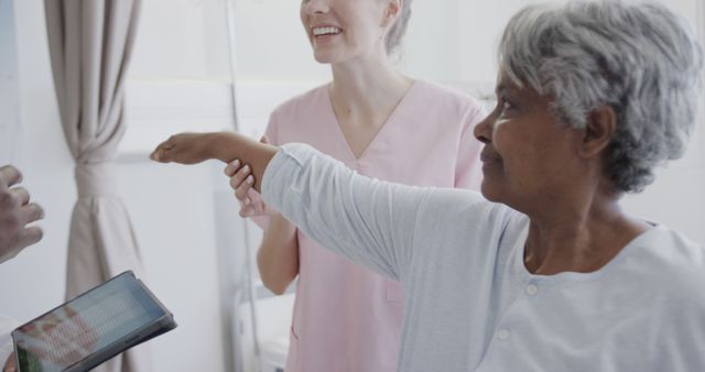 Elderly Woman Receiving Physical Therapy from Caregiver - Download Free Stock Images Pikwizard.com