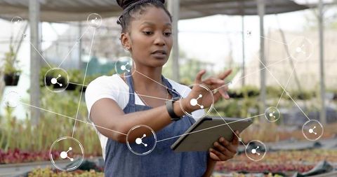 Digital Agriculture: Woman Using Tablet in Garden Centre