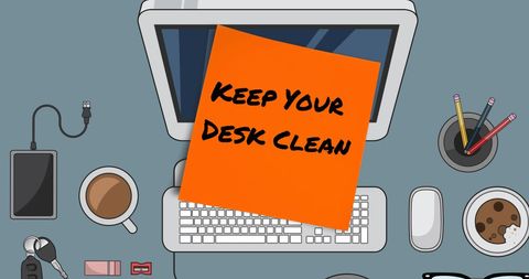Keep your desk clean orange memo note on tidy office desk