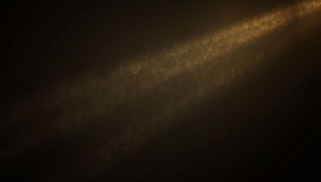 Diaphanous Golden Light Beam with Effervescent Sparkles