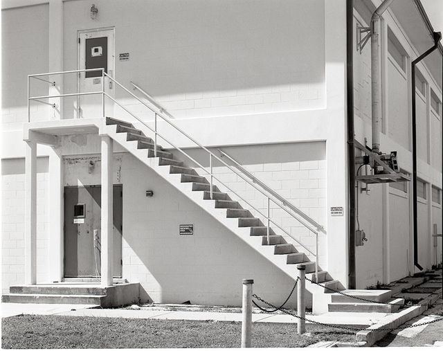 Exterior View of Industrial Building with Metal Staircase - Download Free Stock Photos Pikwizard.com
