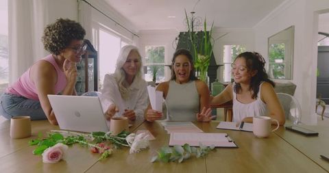 Women Collaborating on Creative Wedding Planning at Home