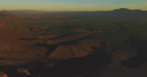 Aerial View of Vast Landscape with Setting Sun Shadows and Transparent Hues - Download Free Stock Videos Pikwizard.com