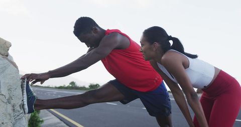 Active Couple Stretching During Outdoor Run on Mountain Road - Download Free Stock Images Pikwizard.com