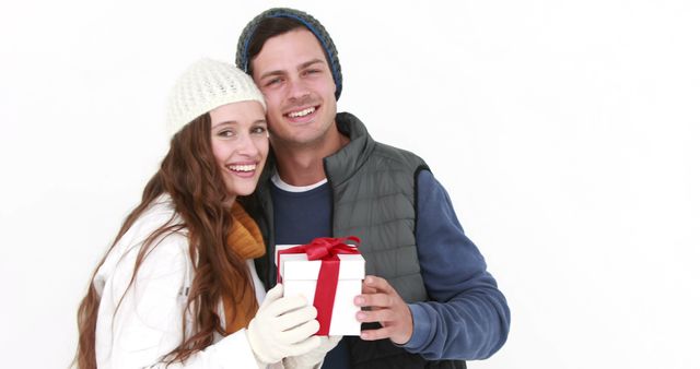 Couple Celebrating Winter Holiday with Gift Exchange - Download Free Stock Images Pikwizard.com