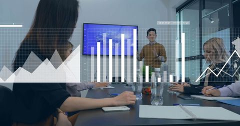 Diverse Team Analyzing Financial Data in Modern Meeting Room