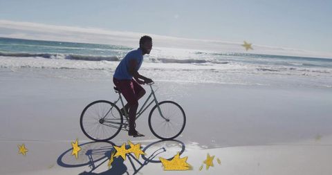 Carefree cycling adventure on sandy shore with starry flair